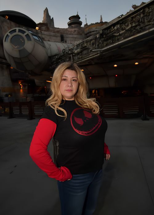 Nicole in front of the Millennium Falcon at Galaxy's Edge
